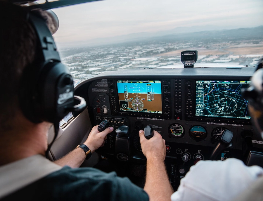 The pilot and an aircraft's control panel